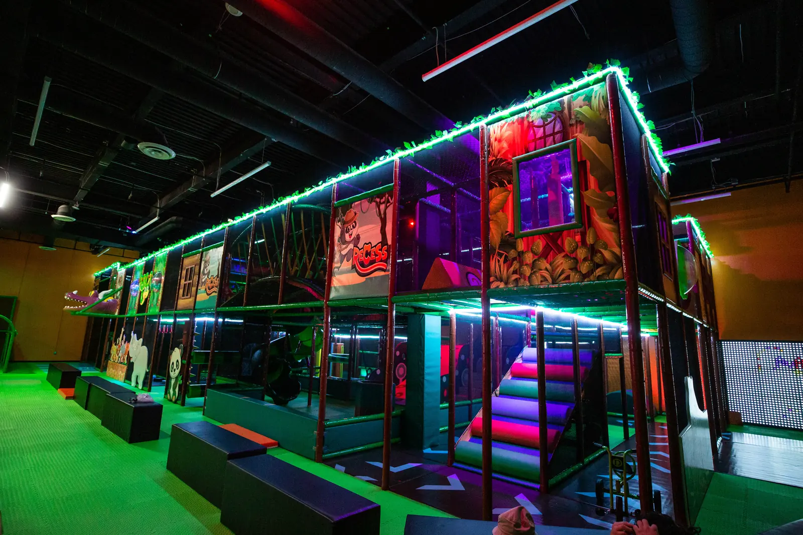 The play structure lit with colorful glow lighting