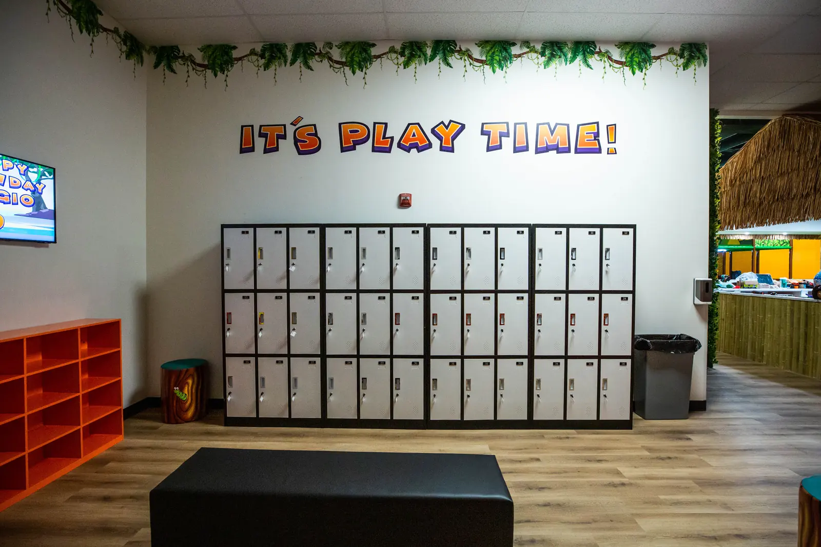 Shoe cubbies near the entrance to the play area